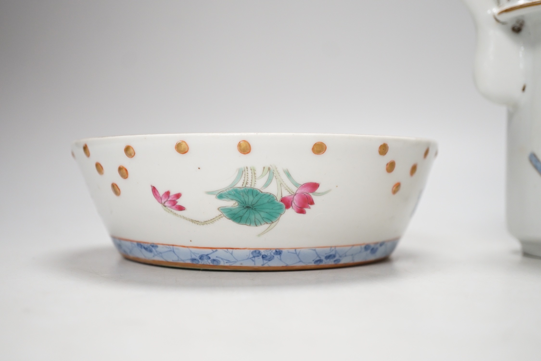 A Chinese famille rose teapot and a cover, together with a similar dish. 12cm tall